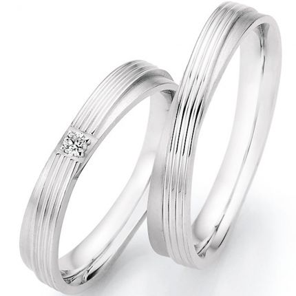 Ringpaar aus Silber mit diagonal verlaufendem Band und wahlweise Brillant